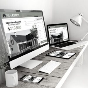 Digital real estate listings displayed on multiple devices, including a computer, laptop, tablet, and phone, on a wooden desk.